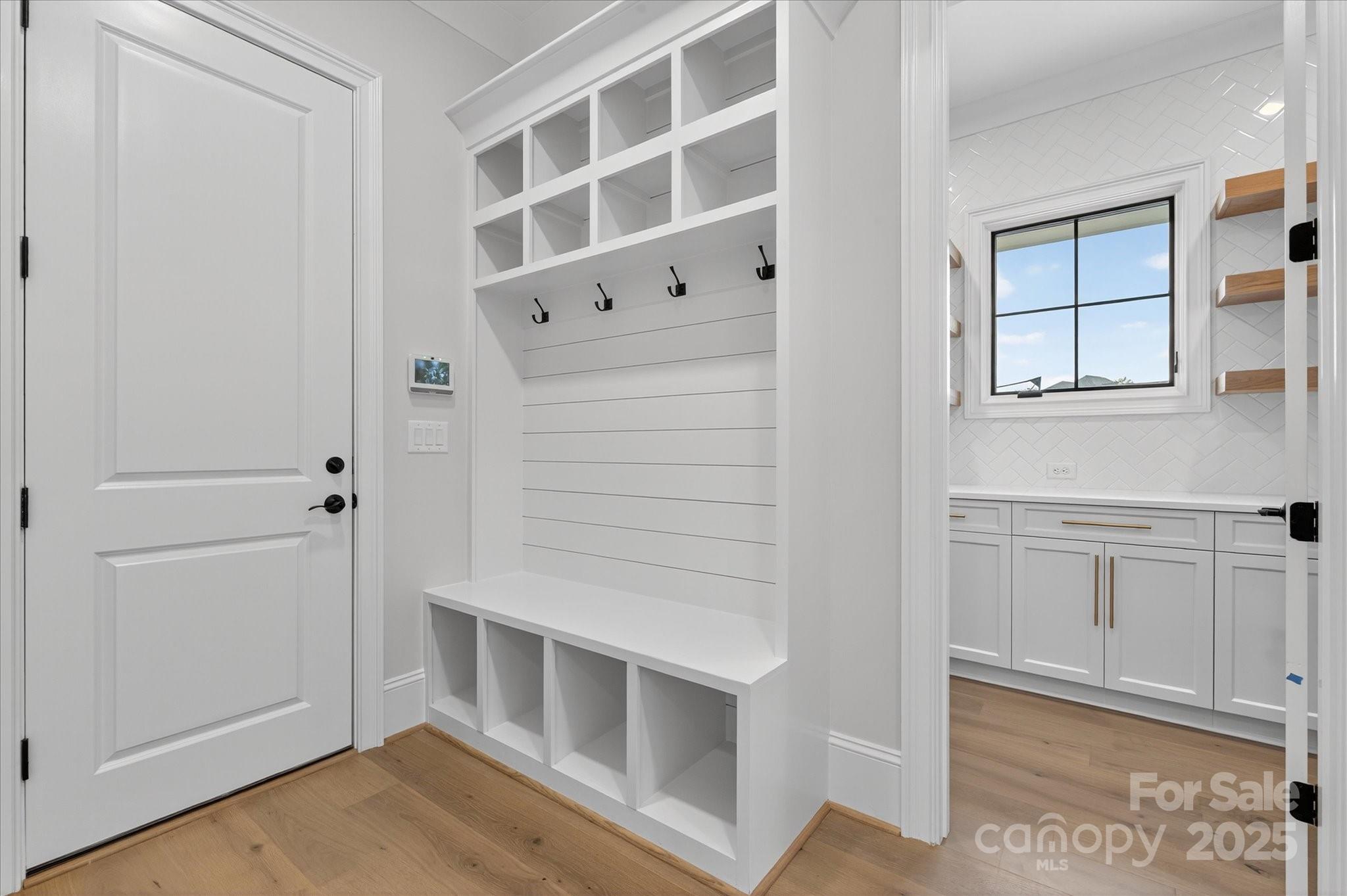 1405 Waxhaw-Marvin Road Waxhaw, NC 28173 - Photo 15 of 46 a view of an empty room with wooden floor and cabinet