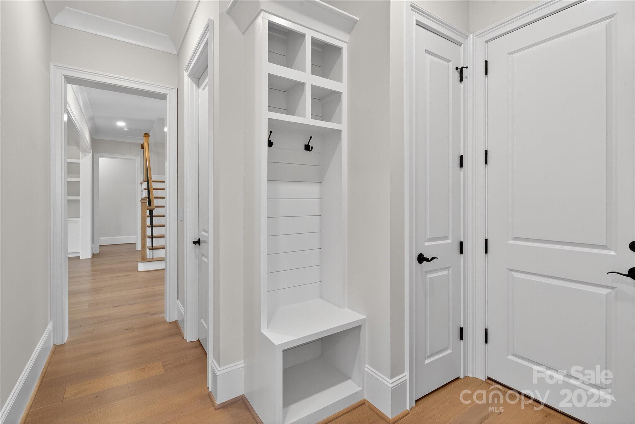 1405 Waxhaw-Marvin Road Waxhaw, NC 28173 - Photo 16 of 46 a view of a hallway with wooden floor and staircase