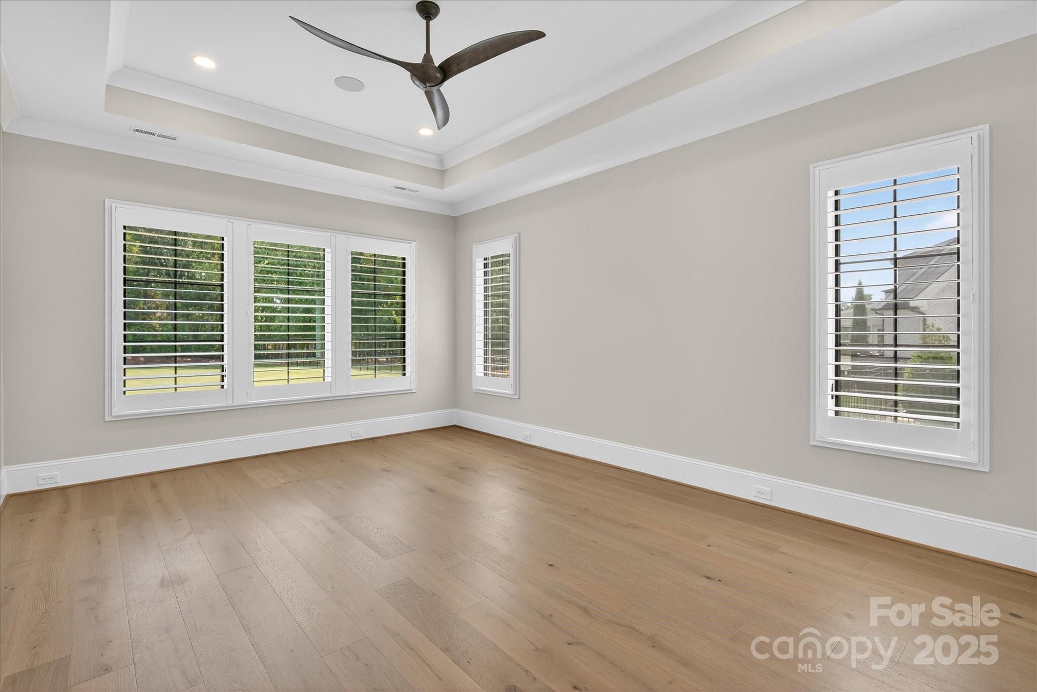 1405 Waxhaw-Marvin Road Waxhaw, NC 28173 - Photo 20 of 46 a view of an empty room with wooden floor and a window