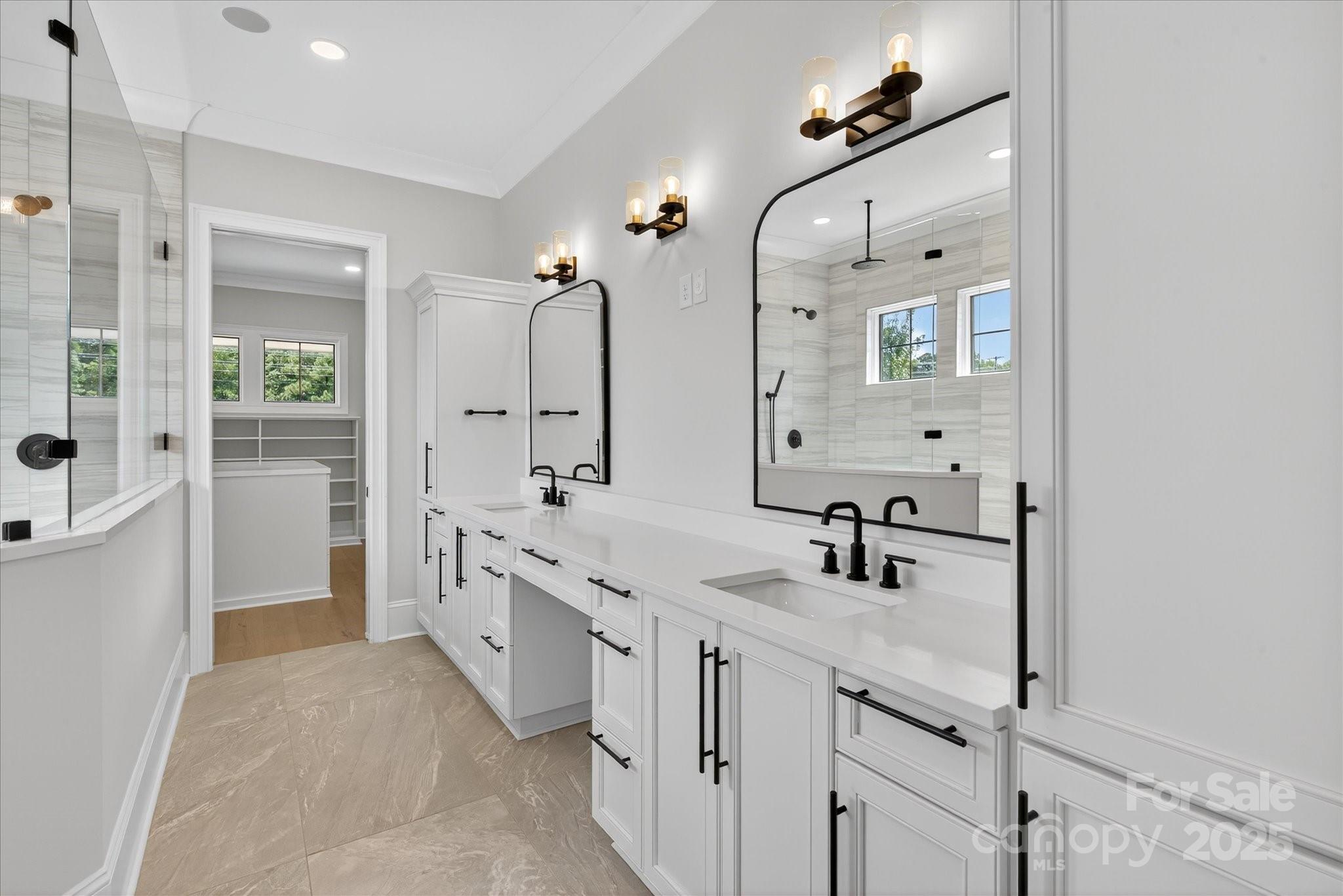 1405 Waxhaw-Marvin Road Waxhaw, NC 28173 - Photo 22 of 46 a bathroom with a granite countertop sink a large mirror and shower