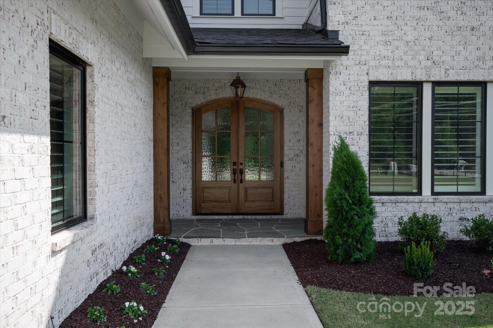 1405 Waxhaw-Marvin Road Waxhaw, NC 28173 - Photo 3 of 46 a front view of a house with a garden