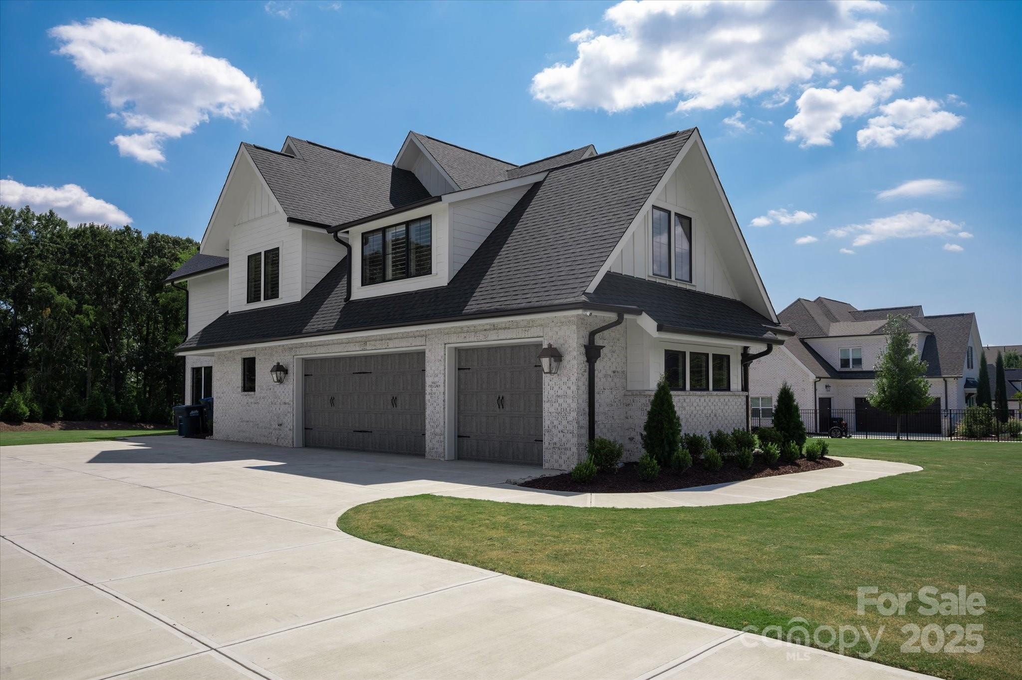 1405 Waxhaw-Marvin Road Waxhaw, NC 28173 - Photo 42 of 46 a front view of a house with a yard and garage