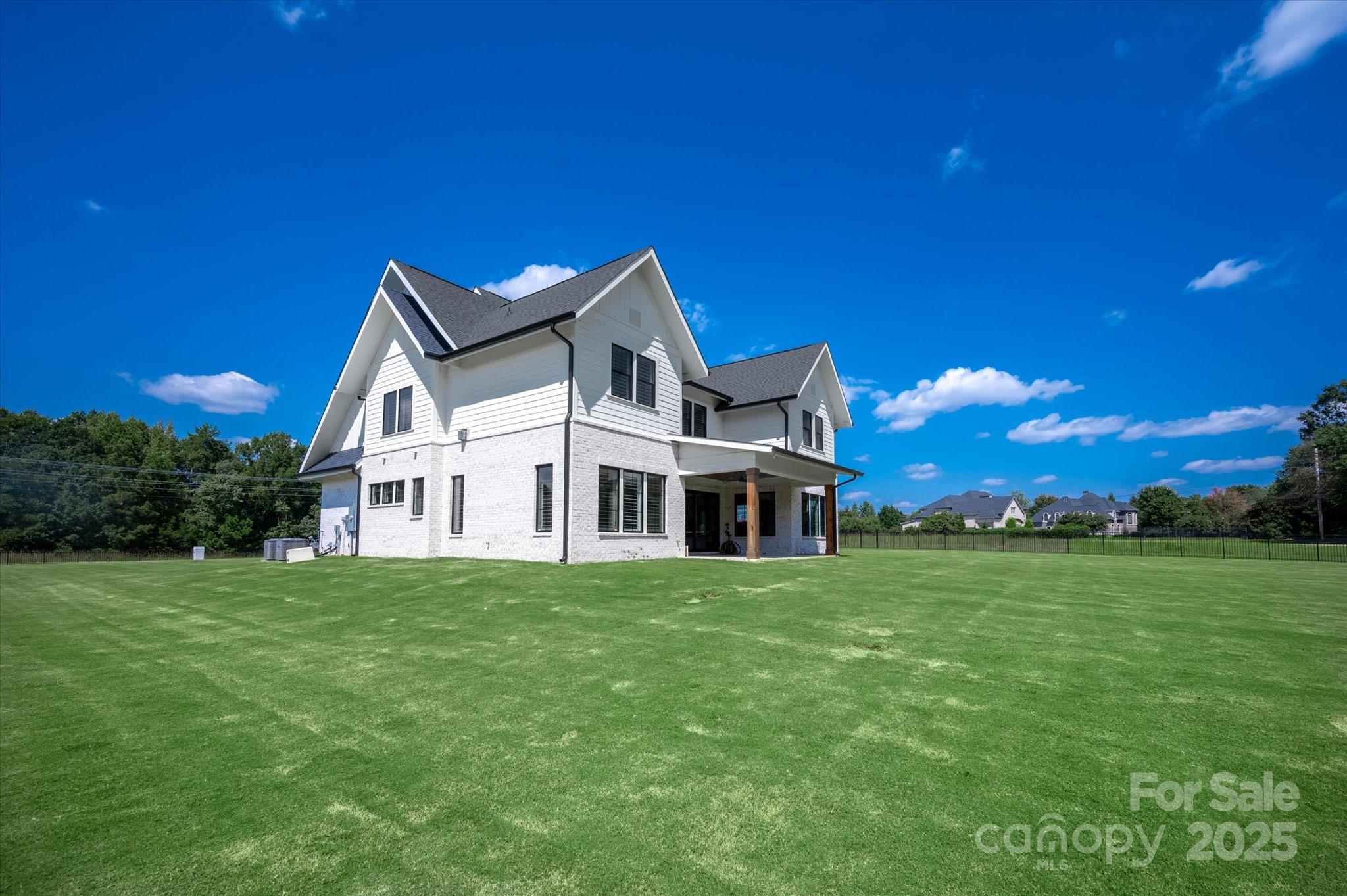 1405 Waxhaw-Marvin Road Waxhaw, NC 28173 - Photo 43 of 46 a front view of a house with a garden
