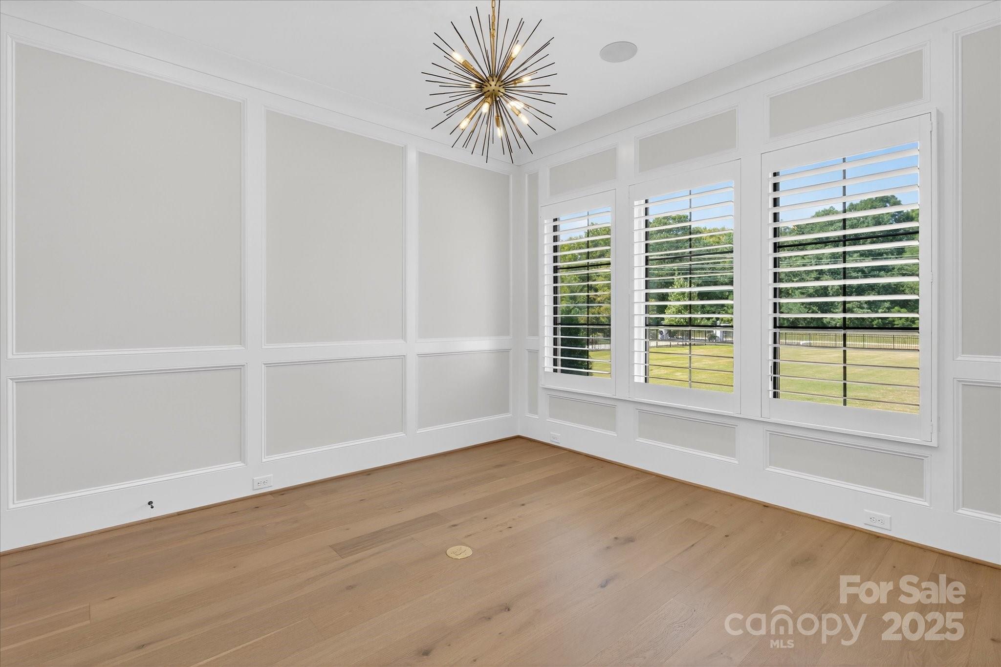 1405 Waxhaw-Marvin Road Waxhaw, NC 28173 - Photo 5 of 46 wooden floor in an empty room with a window