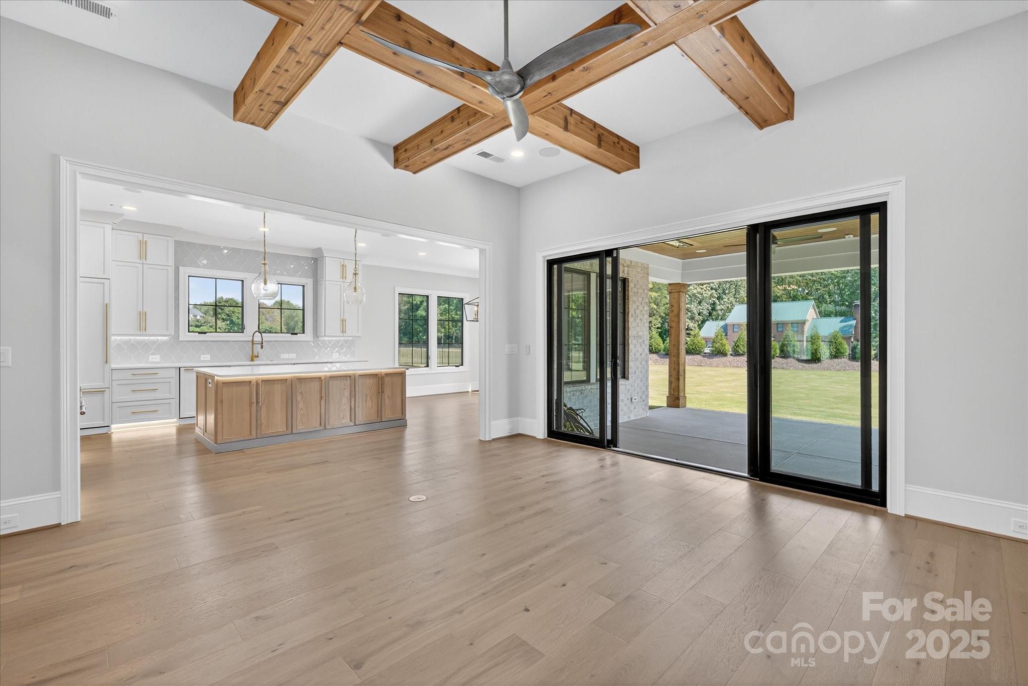 1405 Waxhaw-Marvin Road Waxhaw, NC 28173 - Photo 8 of 46 a large hall with a chandelier fan and windows