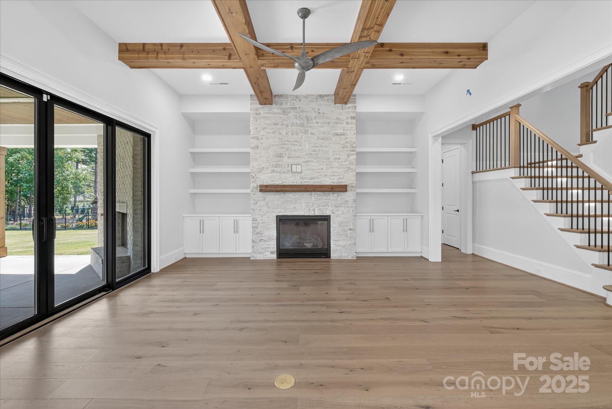 1405 Waxhaw-Marvin Road Waxhaw, NC 28173 - Photo 9 of 46 a view of empty room with wooden floor and fireplace