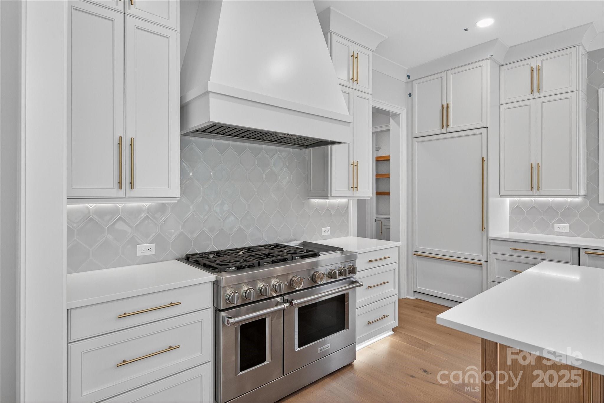 1405 Waxhaw-Marvin Road Waxhaw, NC 28173 - Photo 10 of 46 a kitchen with stainless steel appliances granite countertop white cabinets and a refrigerator