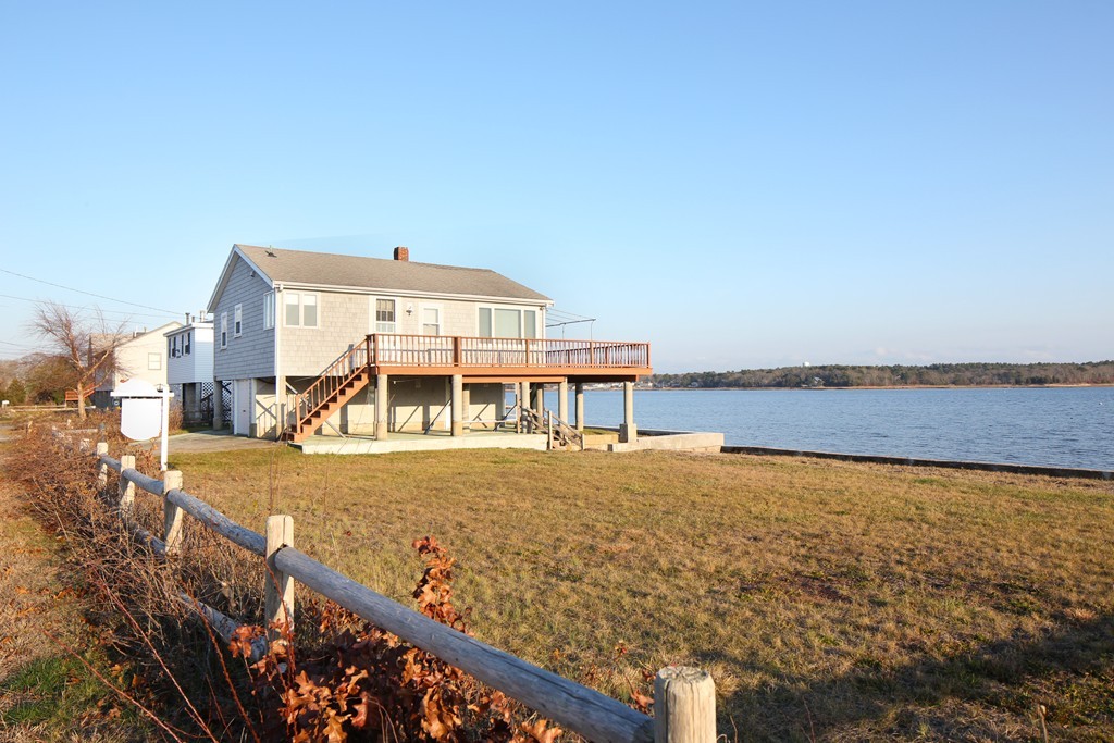 a view of a balcony with an ocean