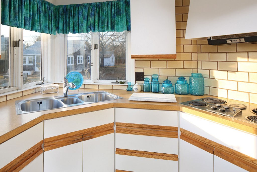 39 Beach Street Wareham, MA 02571 - Photo 12 of 24 a kitchen with a sink and a large window