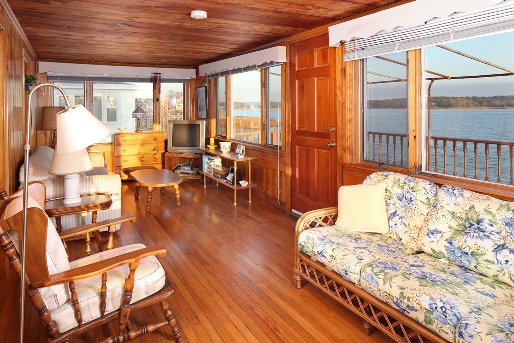 39 Beach Street Wareham, MA 02571 - Photo 15 of 24 a living room with furniture a large window and wooden floor