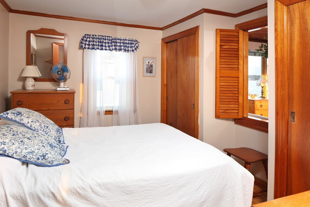 39 Beach Street Wareham, MA 02571 - Photo 19 of 24 a bedroom with a bed and a dresser