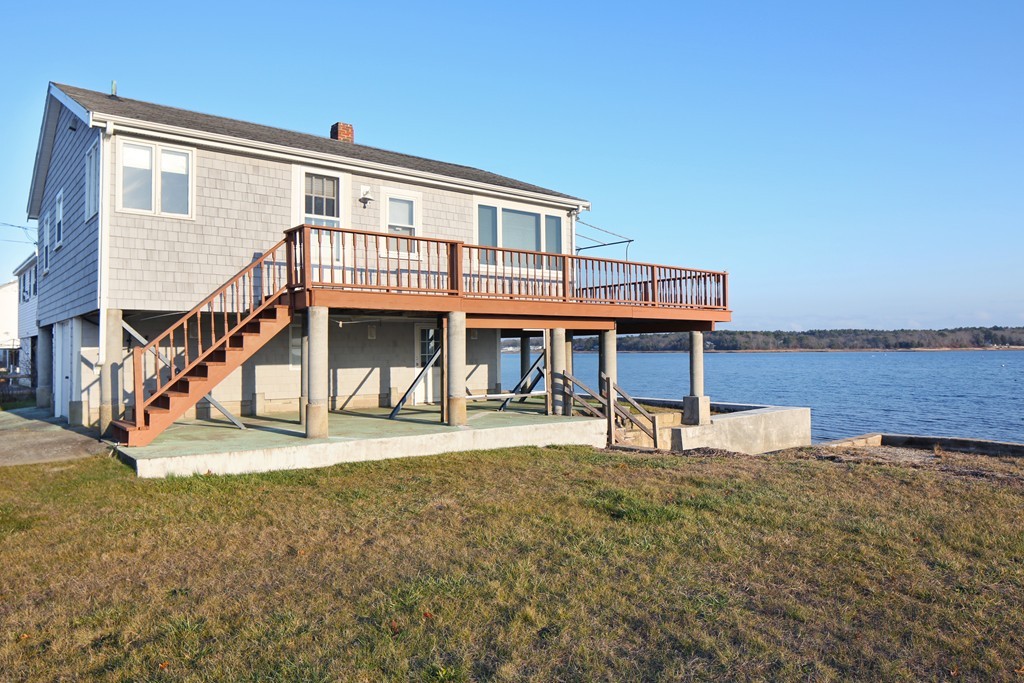 39 Beach Street Wareham, MA 02571 - Photo 4 of 24 a front view of a house with a yard
