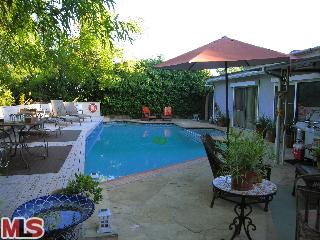 21253 Chagall Road Topanga, CA 90290 - Photo 1 of 1 a view of a backyard with sitting area and furniture