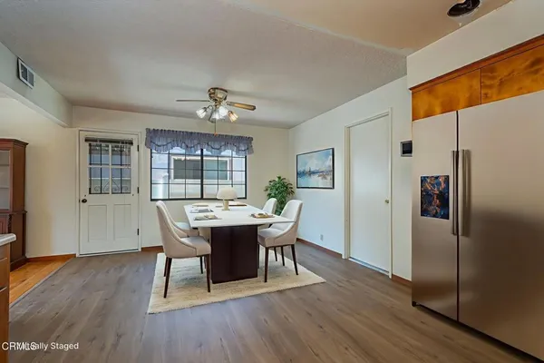 a view of a dining room with furniture window and wooden floor