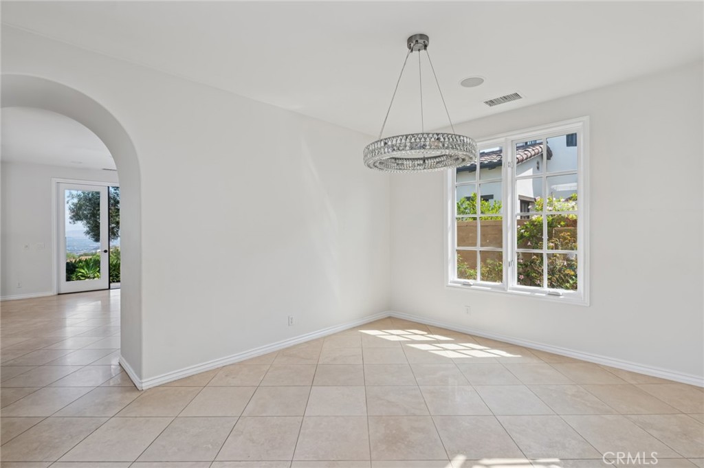 4 Still Water Newport Coast, CA 92657 - Photo 16 of 43 a view of a room with window and a chandelier