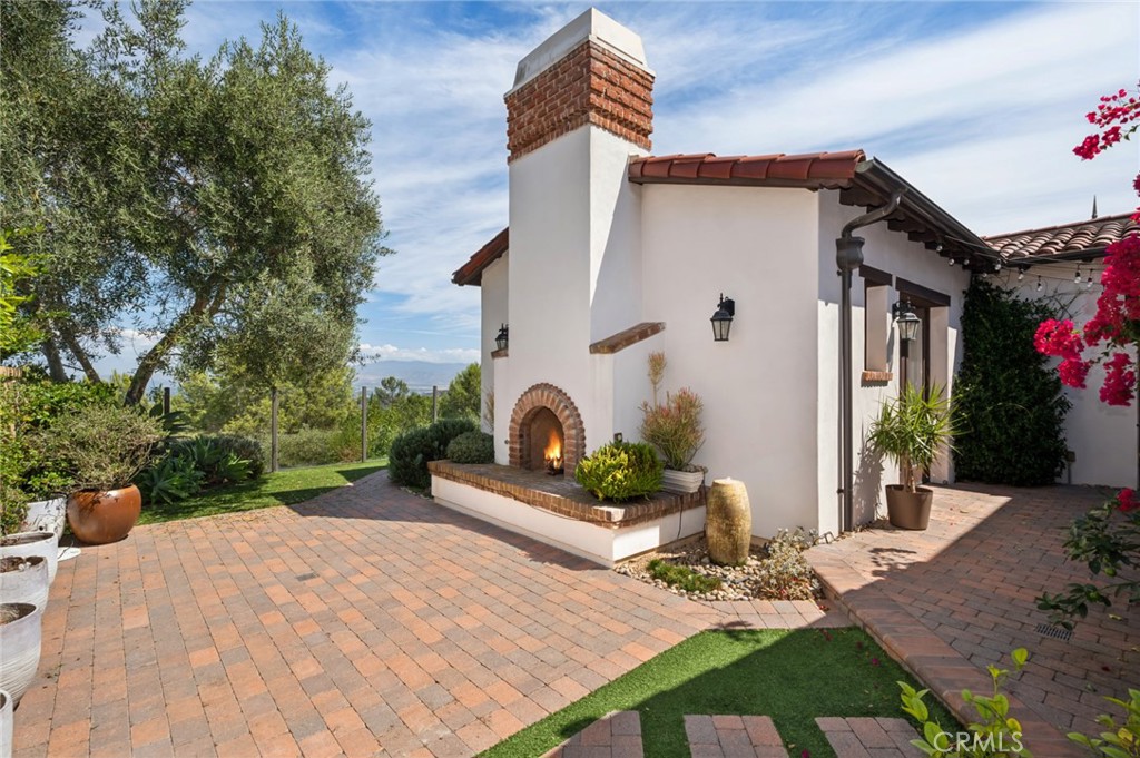4 Still Water Newport Coast, CA 92657 - Photo 24 of 43 a front view of a house with garden