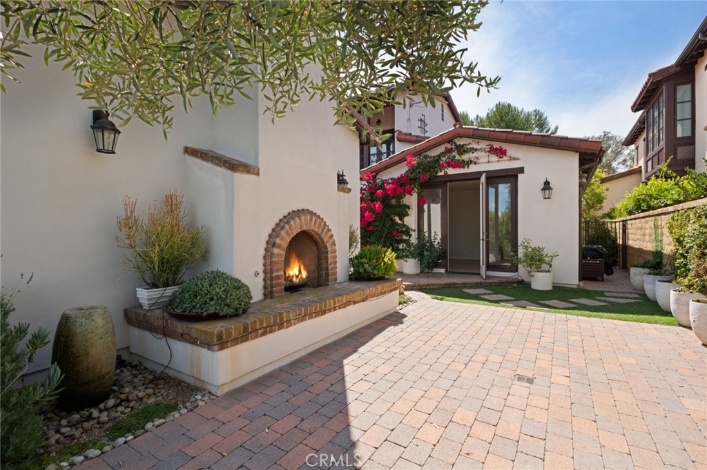 4 Still Water Newport Coast, CA 92657 - Photo 25 of 43 a front view of a house with garden