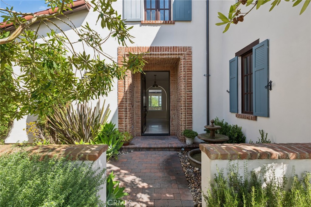 4 Still Water Newport Coast, CA 92657 - Photo 4 of 43 a front view of a house with a yard