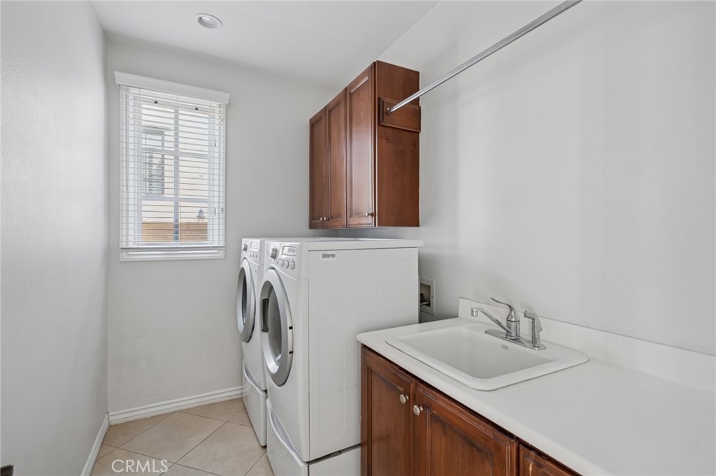 4 Still Water Newport Coast, CA 92657 - Photo 43 of 43 a bathroom with a sink and washing machine