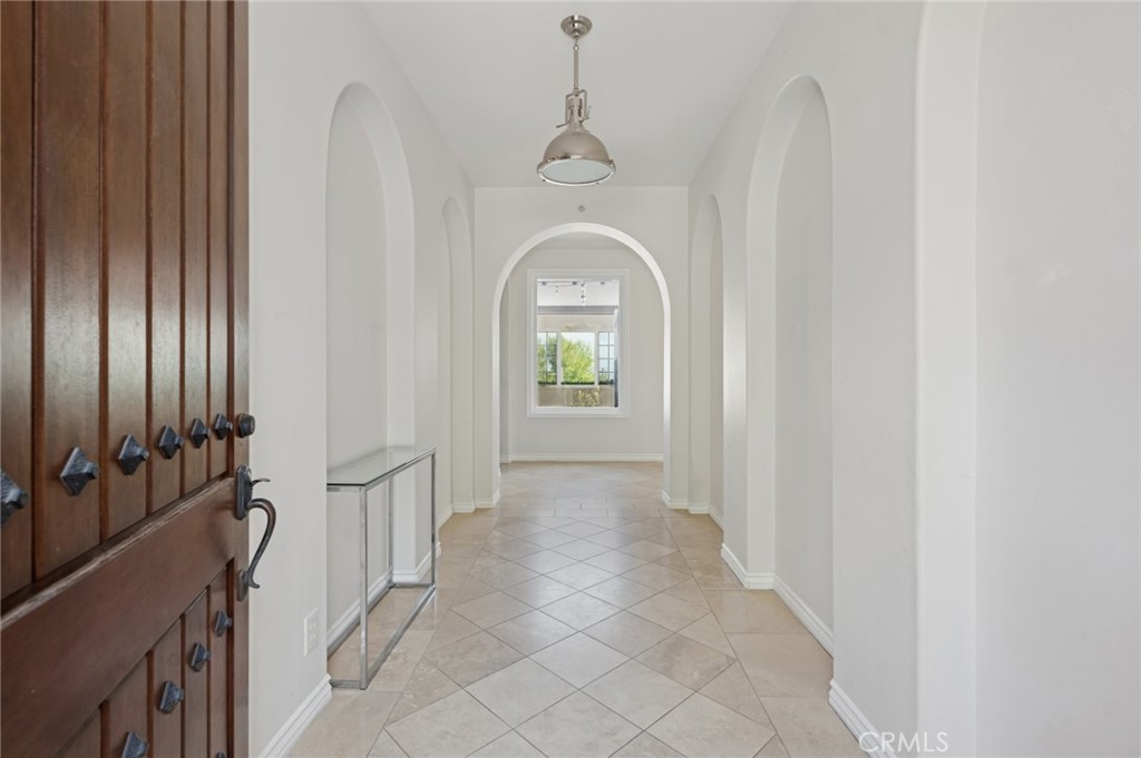 4 Still Water Newport Coast, CA 92657 - Photo 6 of 43 a view of a hallway with windows