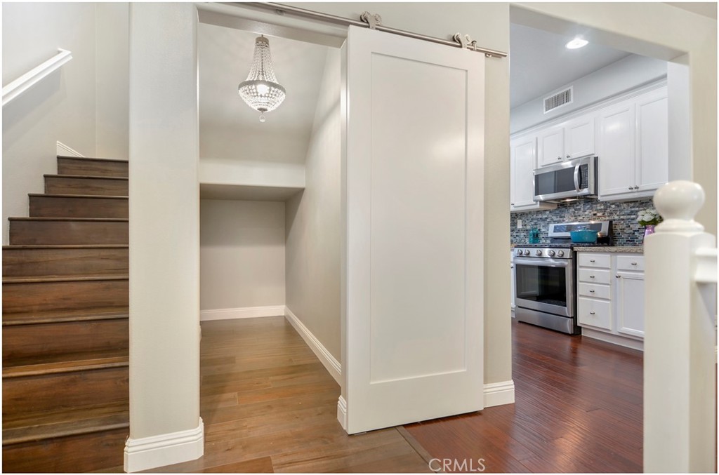 2 Hinterland Way Ladera Ranch, CA 92694 - Photo 11 of 29 a view of a kitchen cabinets and wooden floor