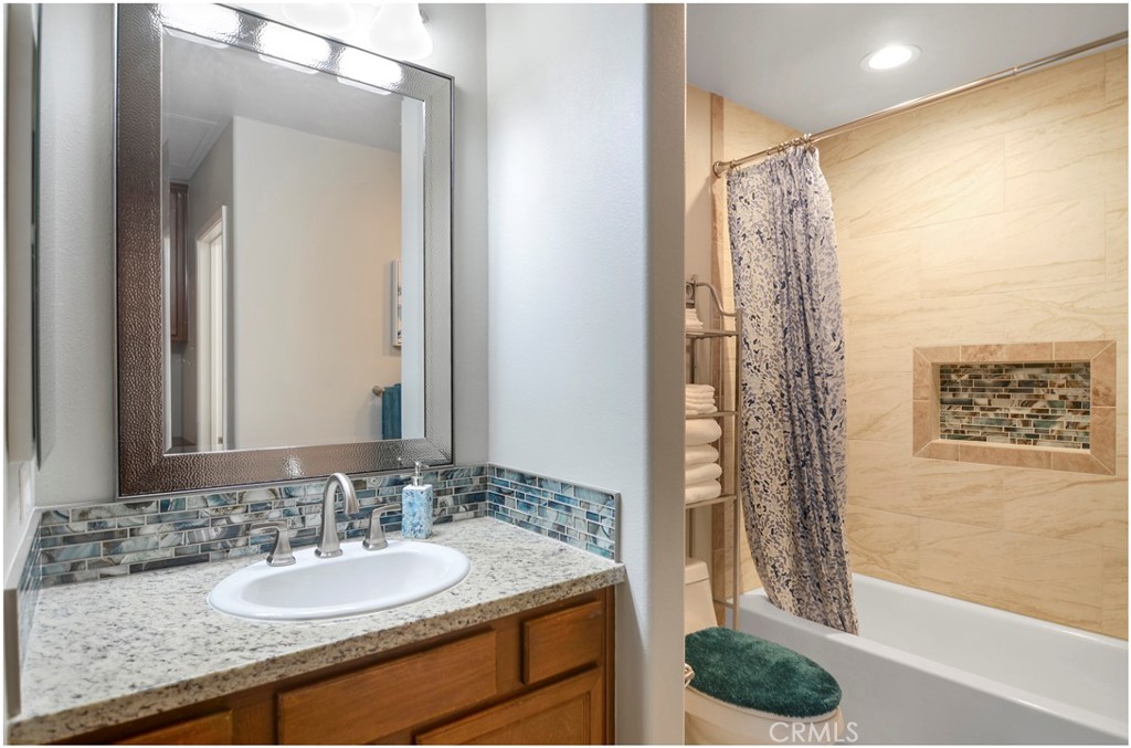 2 Hinterland Way Ladera Ranch, CA 92694 - Photo 21 of 29 a bathroom with a granite countertop sink and a mirror