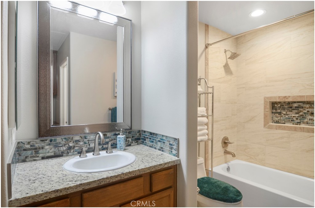 2 Hinterland Way Ladera Ranch, CA 92694 - Photo 22 of 29 a bathroom with a granite countertop sink and a mirror