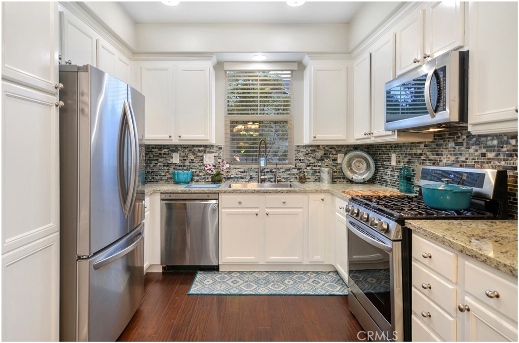 2 Hinterland Way Ladera Ranch, CA 92694 - Photo 3 of 29 a kitchen with a stove a sink and a refrigerator