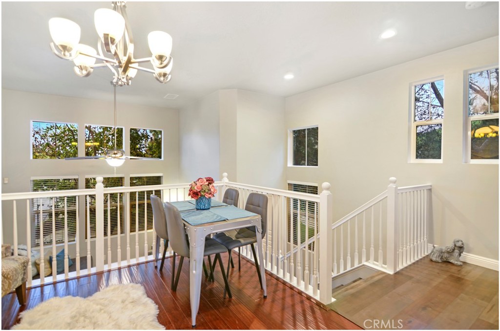 2 Hinterland Way Ladera Ranch, CA 92694 - Photo 8 of 29 a view of a dining room with furniture wooden floor and chandelier