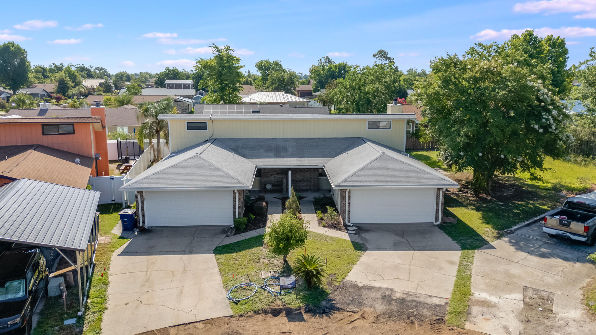 an aerial view of a house with a garden