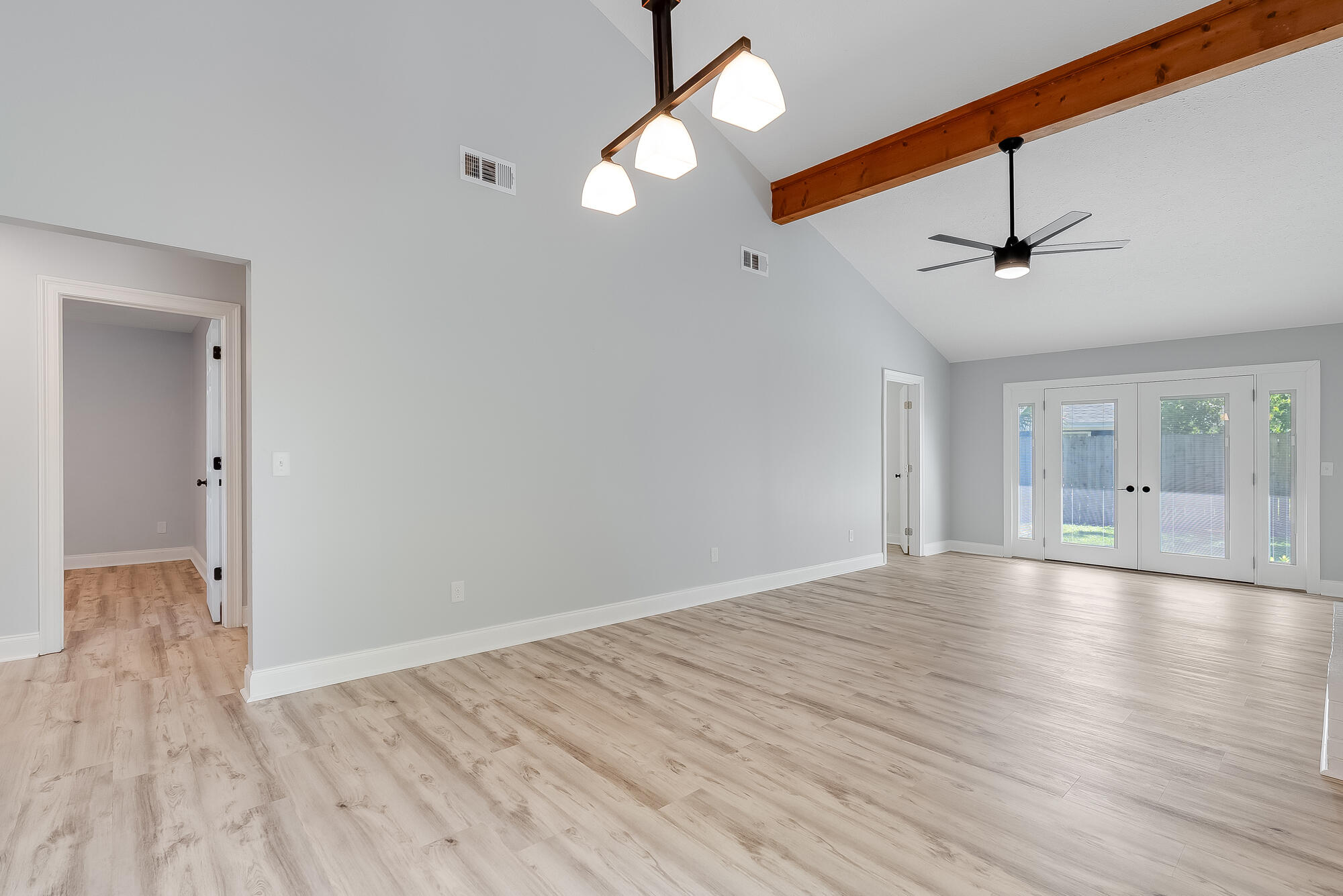 1307 Calabria Road, Unit 4A Panama City, FL 32405 - Photo 15 of 35 wooden floor in an empty room with a window