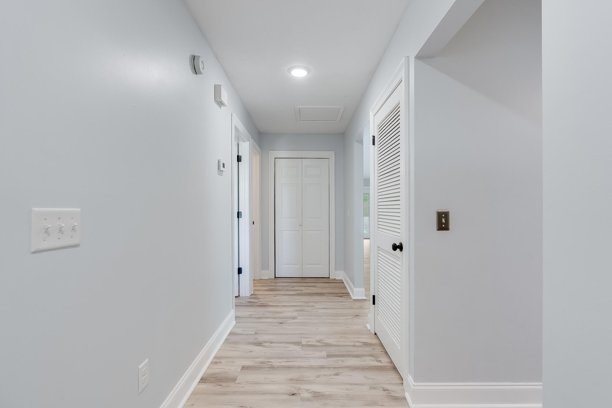 1307 Calabria Road, Unit 4A Panama City, FL 32405 - Photo 25 of 35 a view of a hallway with wooden floor