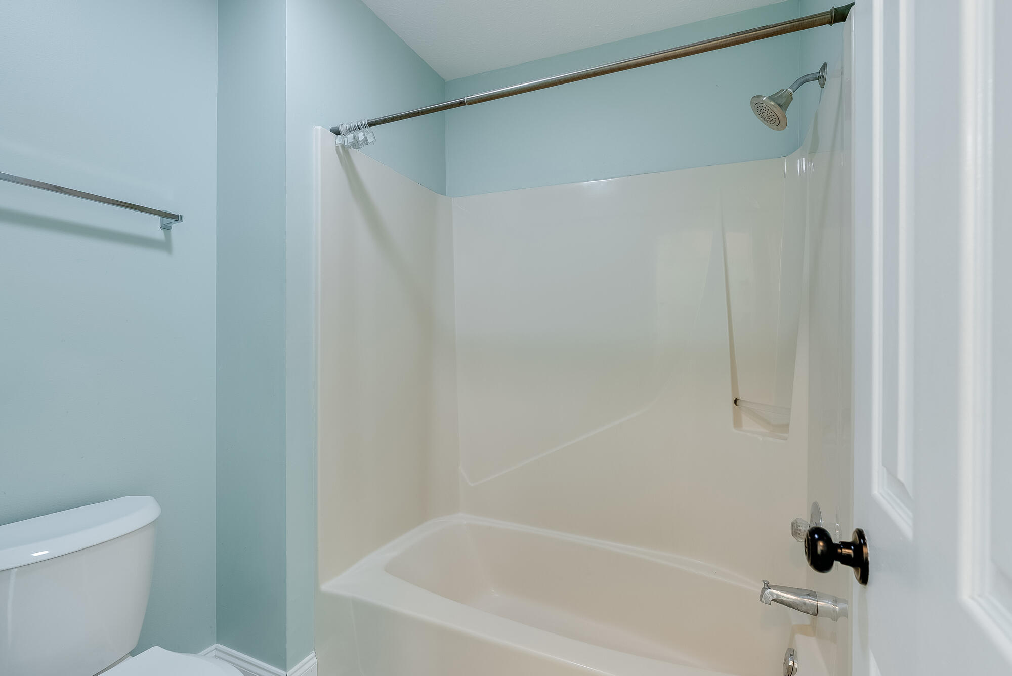 1307 Calabria Road, Unit 4A Panama City, FL 32405 - Photo 29 of 35 a bath room with a toilet and a bath tub