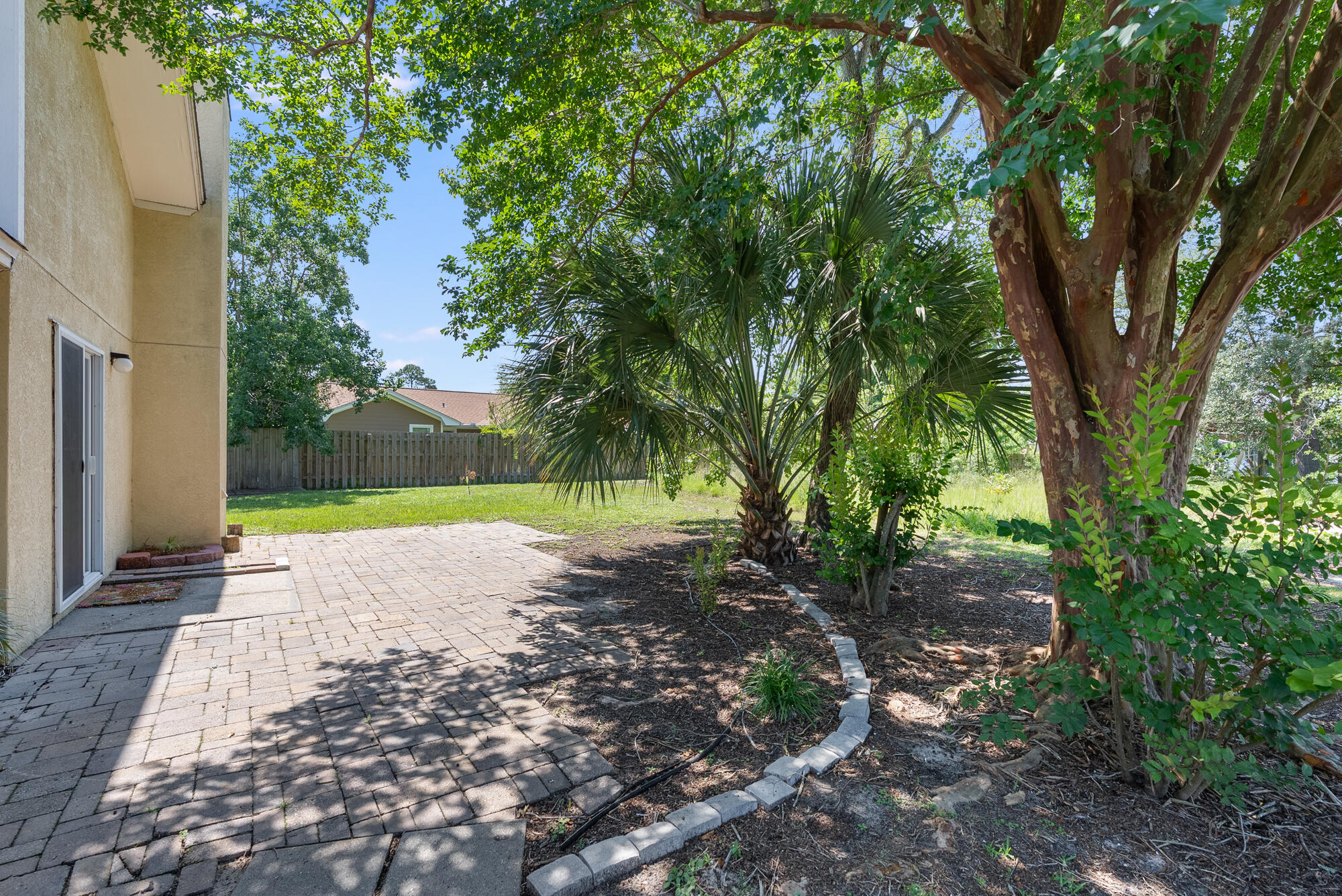 1307 Calabria Road, Unit 4A Panama City, FL 32405 - Photo 31 of 35 a view of a road with a yard