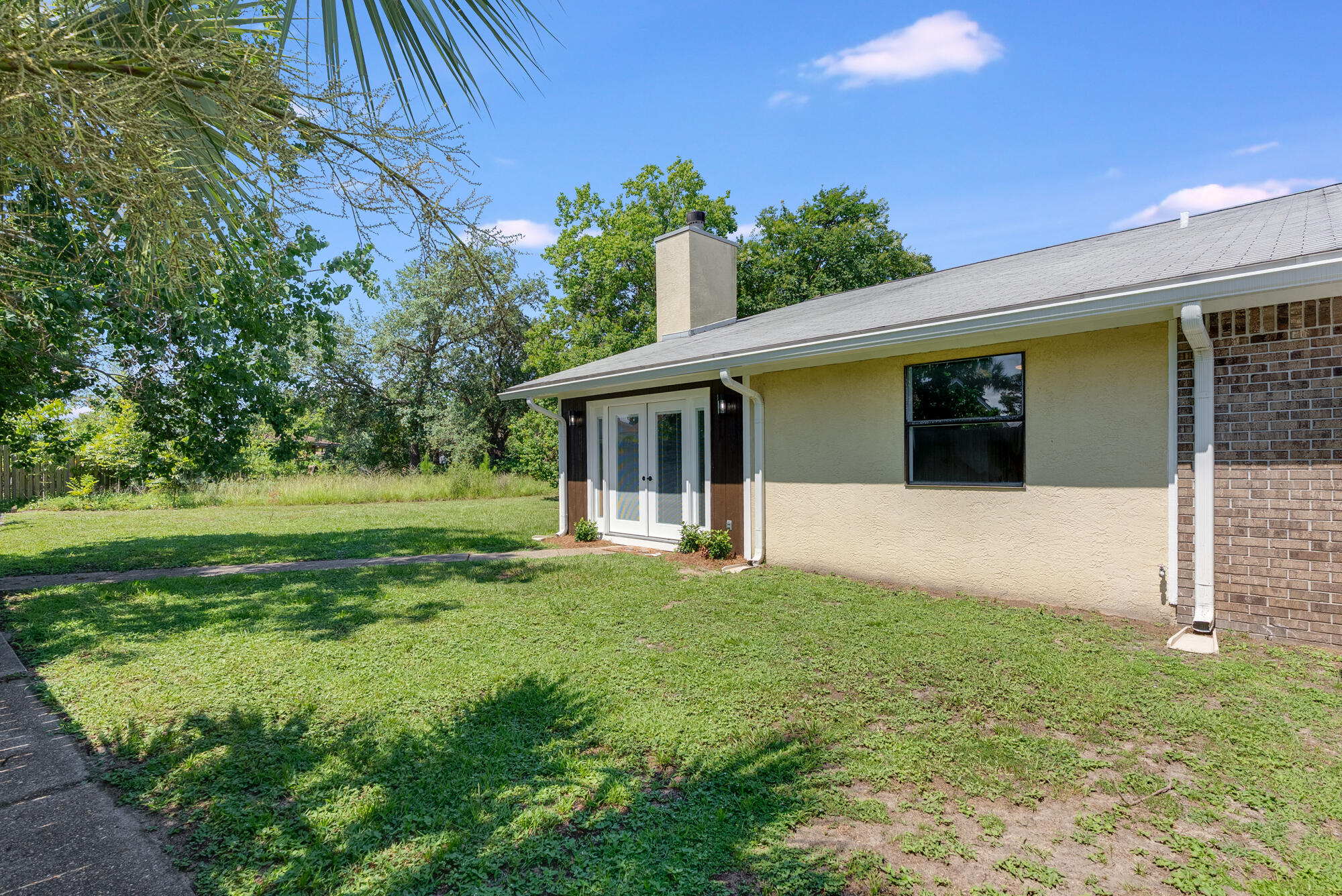 1307 Calabria Road, Unit 4A Panama City, FL 32405 - Photo 32 of 35 a front view of a house with a yard
