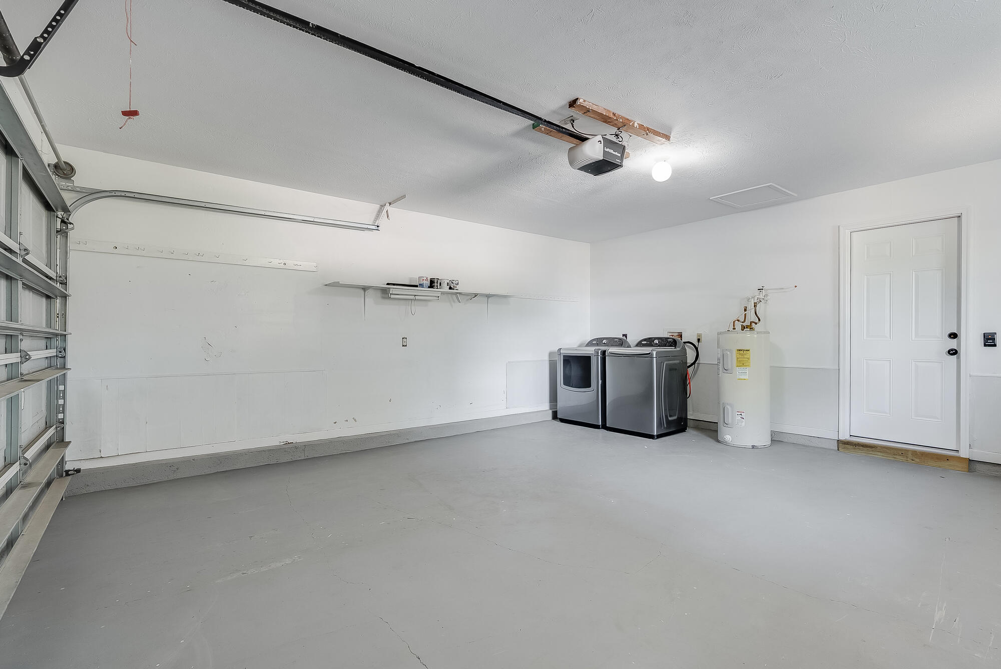 1307 Calabria Road, Unit 4A Panama City, FL 32405 - Photo 34 of 35 an empty room with a cabinet and mirrors