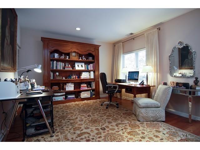 732 West 15th Street Chicago, IL 60607 - Photo 2 of 12 a living room with furniture a rug and a bookshelf