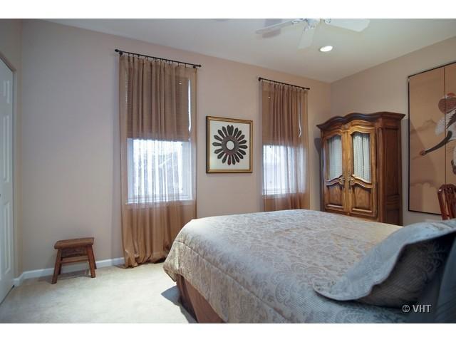 732 West 15th Street Chicago, IL 60607 - Photo 8 of 12 a bedroom with a bed dresser and a window