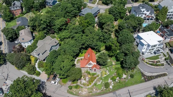 an aerial view of a house with a garden