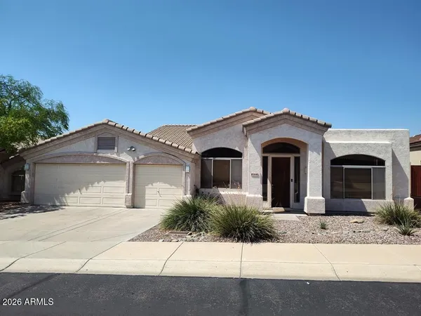 a front view of a house with yard