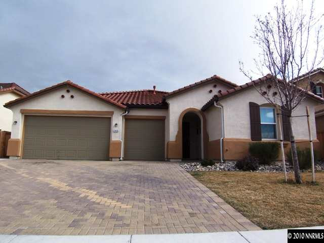 11410 Cervino Drive Reno, NV 89521 - Photo 1 of 13 a front view of a house with a yard