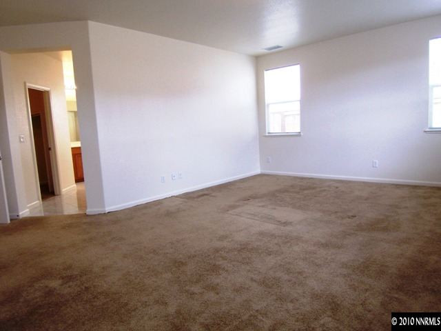 11410 Cervino Drive Reno, NV 89521 - Photo 7 of 13 an empty room with windows and closet