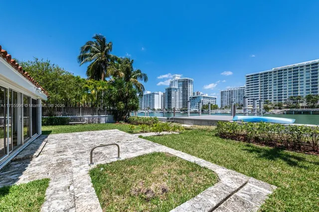 a view of a swimming pool with a patio