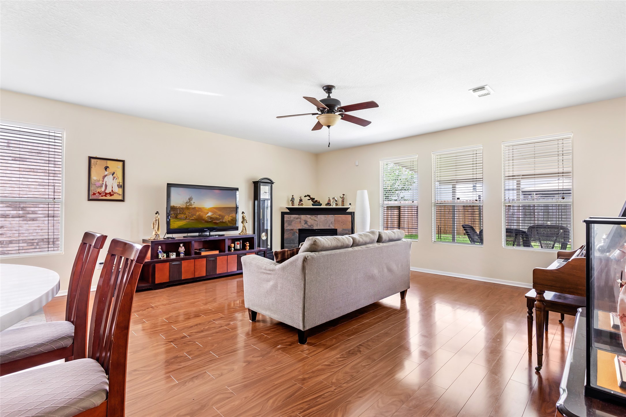 12122 Landsdown Ridge Way Humble, TX 77346 - Photo 10 of 34 a living room with furniture a flat screen tv and wooden floor