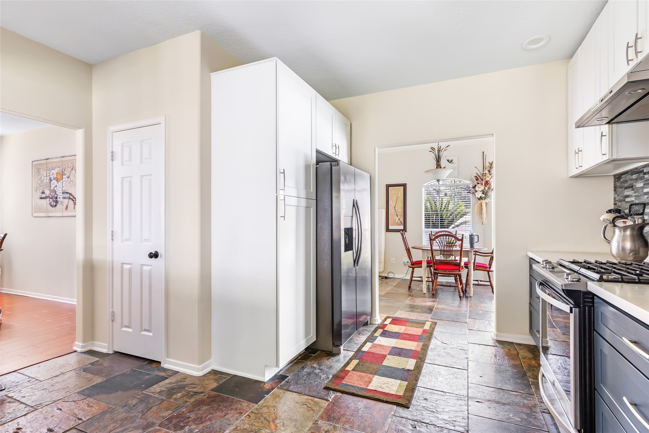 12122 Landsdown Ridge Way Humble, TX 77346 - Photo 12 of 34 a room with stainless steel appliances kitchen island granite countertop a refrigerator and a sink