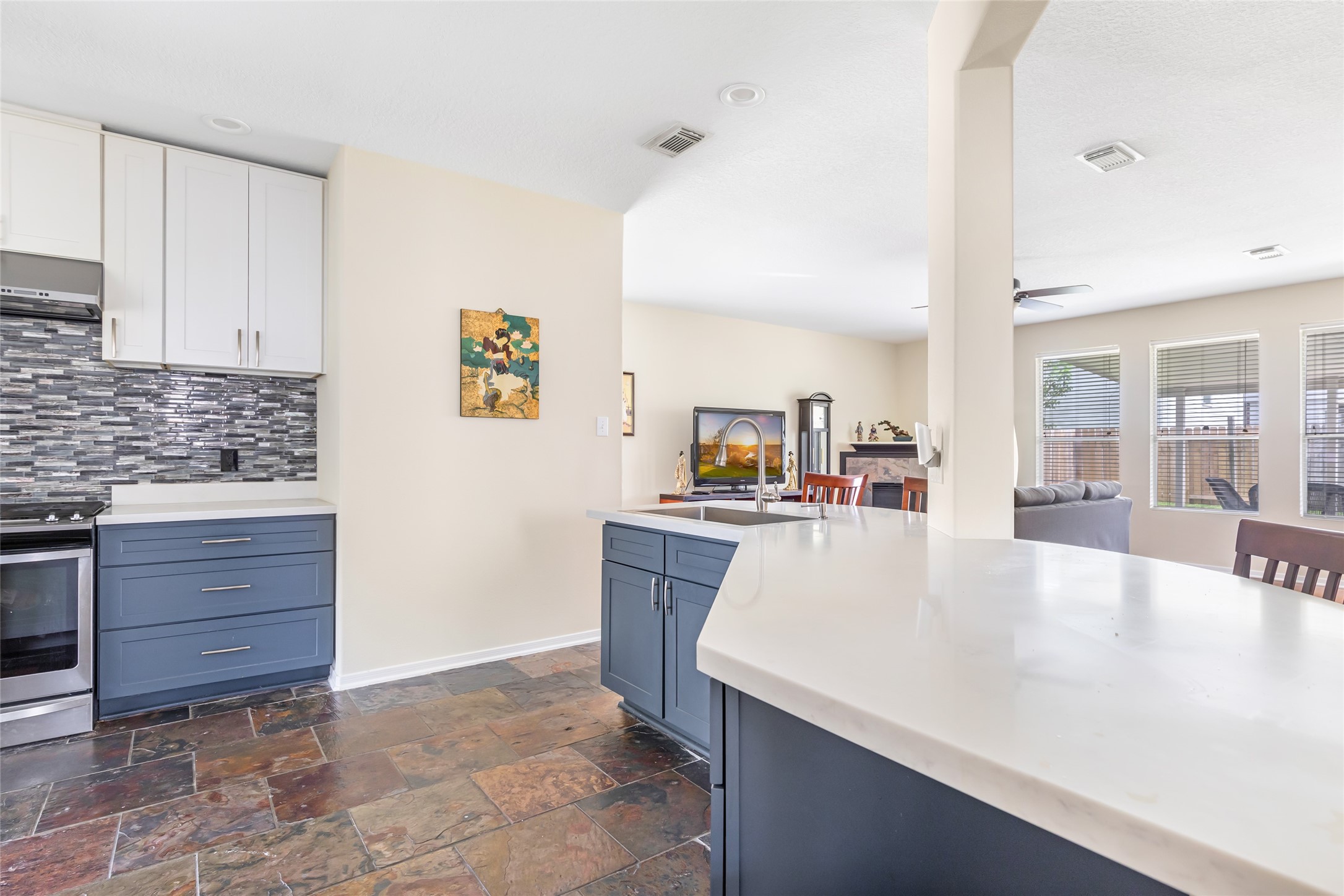 12122 Landsdown Ridge Way Humble, TX 77346 - Photo 13 of 34 a living room with granite countertop furniture and a kitchen view