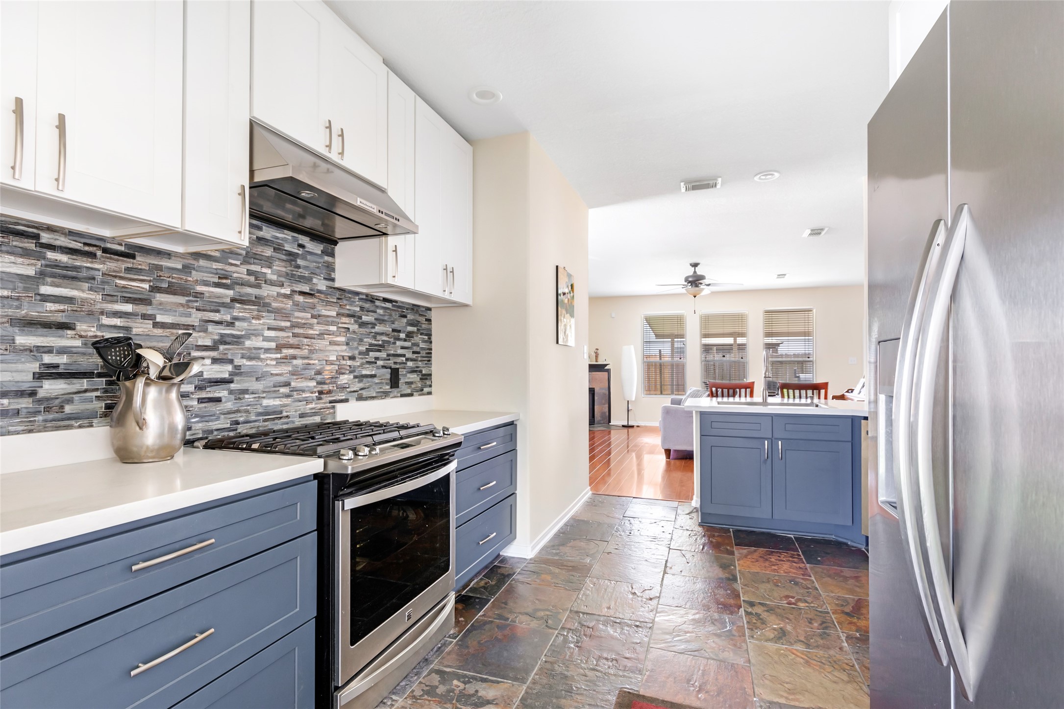 12122 Landsdown Ridge Way Humble, TX 77346 - Photo 15 of 34 a kitchen with stainless steel appliances granite countertop a refrigerator and a stove