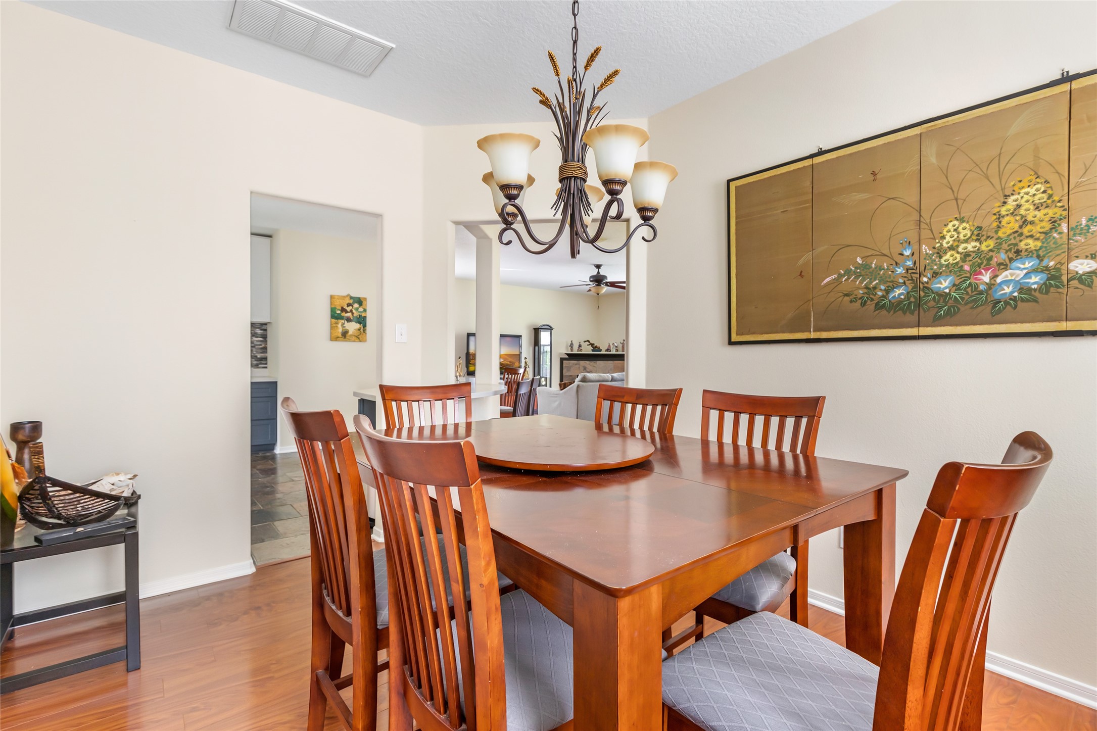 12122 Landsdown Ridge Way Humble, TX 77346 - Photo 18 of 34 a view of a dining room with furniture and wooden floor