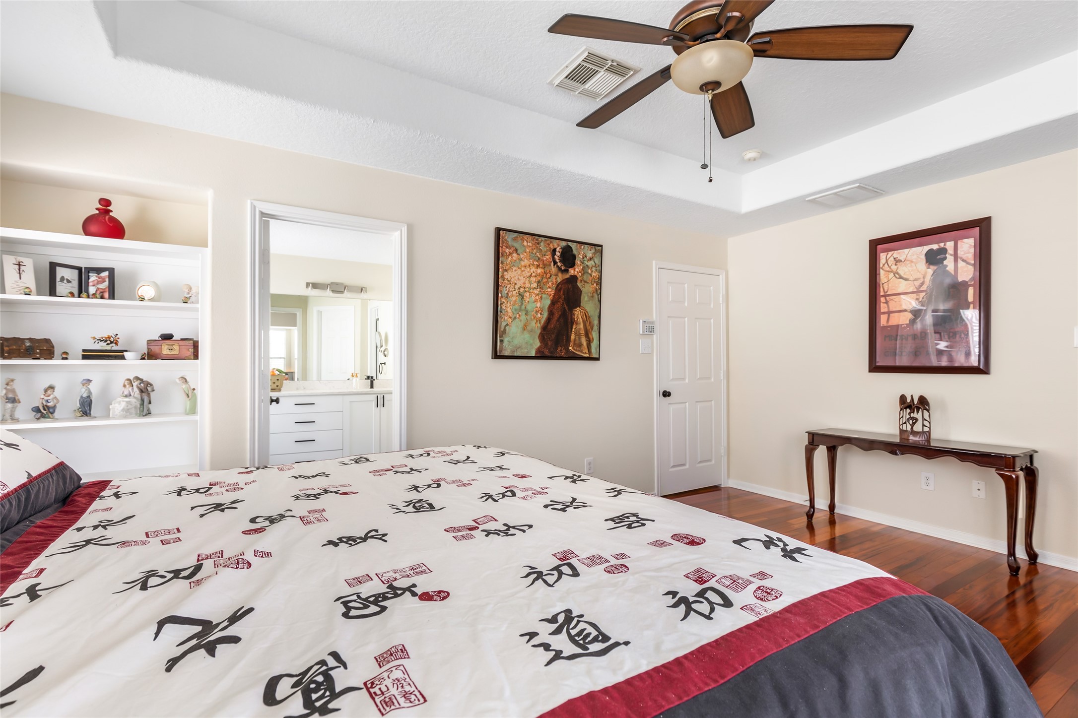 12122 Landsdown Ridge Way Humble, TX 77346 - Photo 27 of 34 a bedroom that has a bed and a chandelier