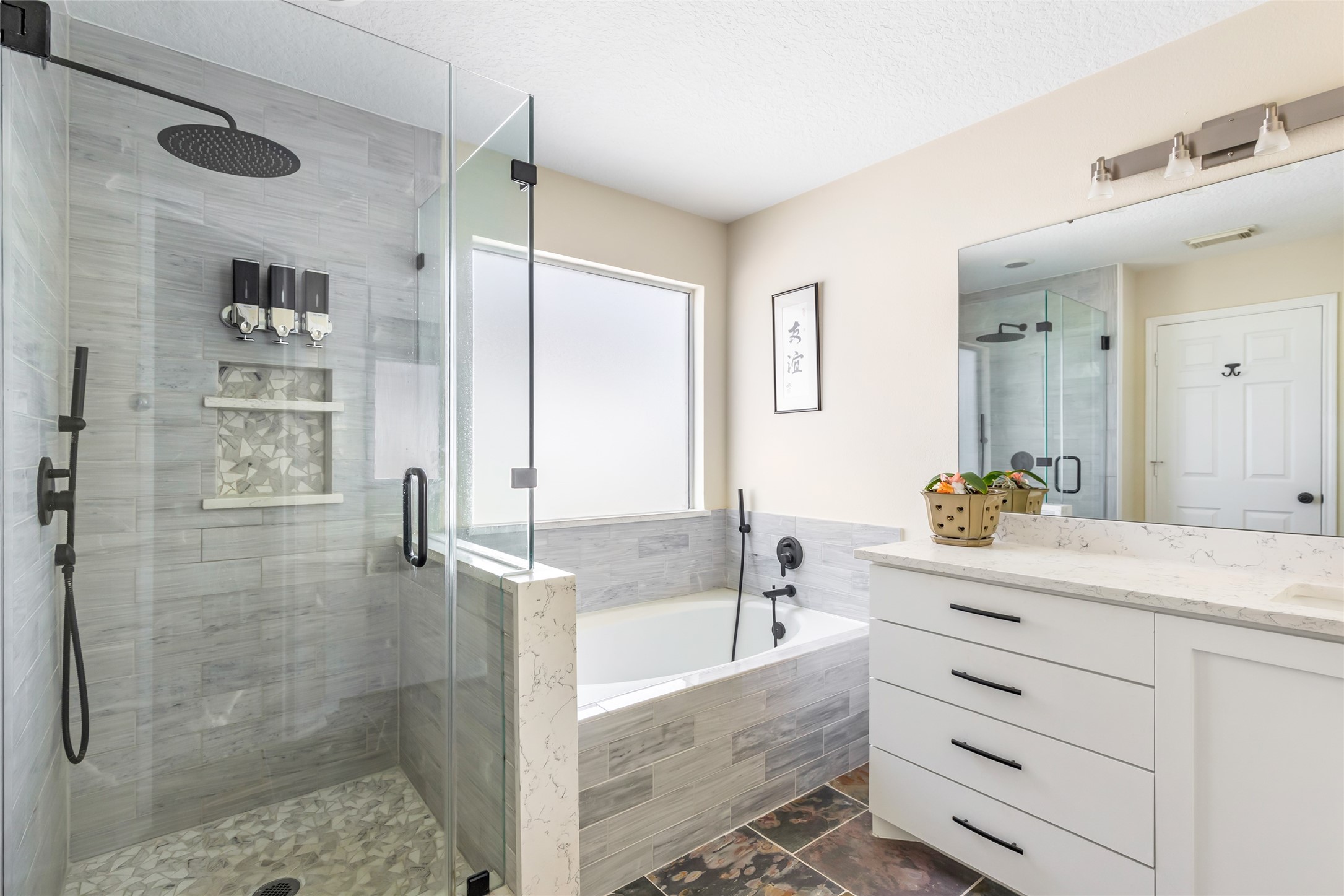 12122 Landsdown Ridge Way Humble, TX 77346 - Photo 29 of 34 a bathroom with a granite countertop sink a mirror and shower